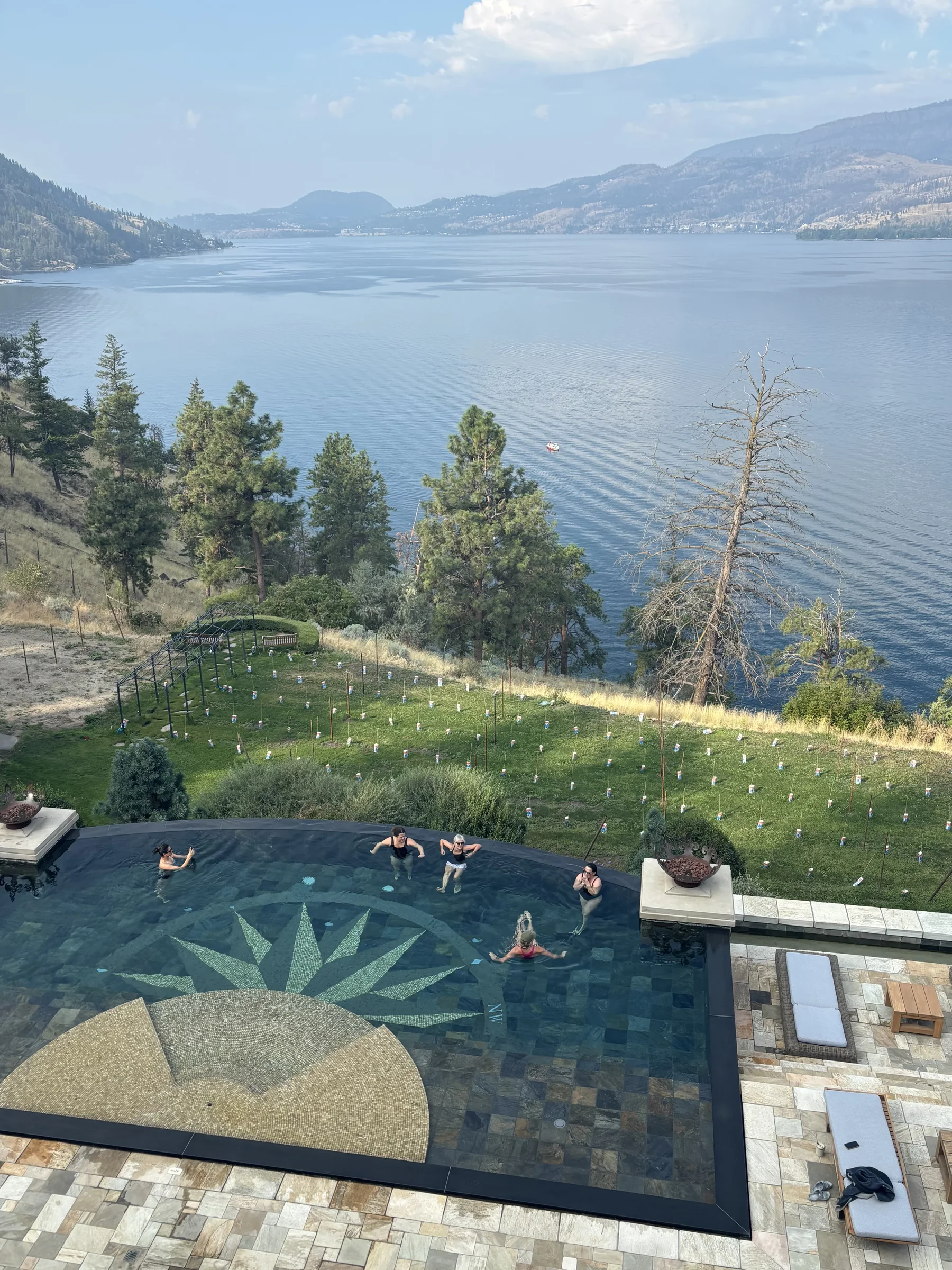 Family day at the pool overlooking Okanagan Lake